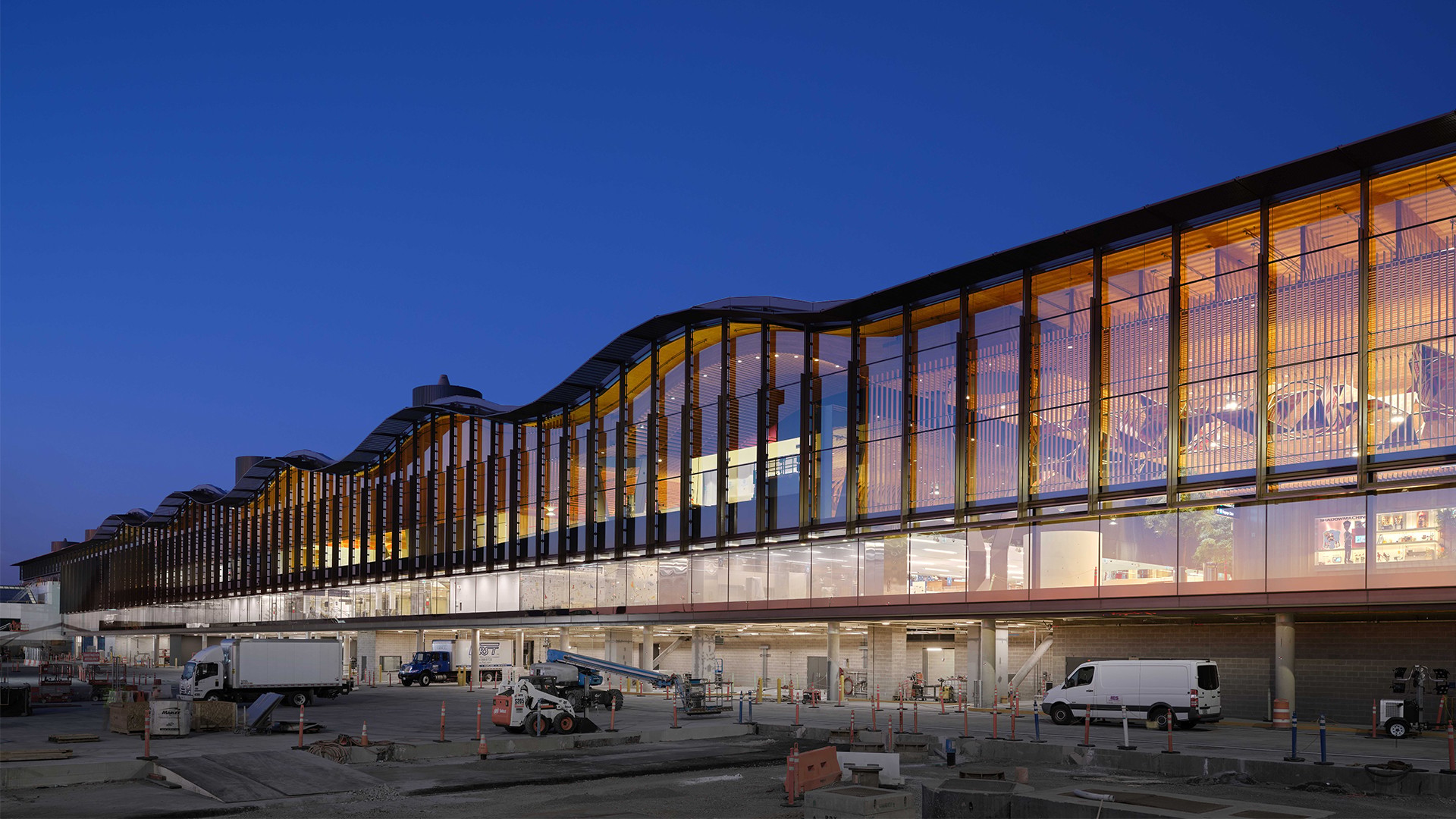 Modern airport with large exterior glass and wavy roof Modern airport with large exterior glass and wavy roof