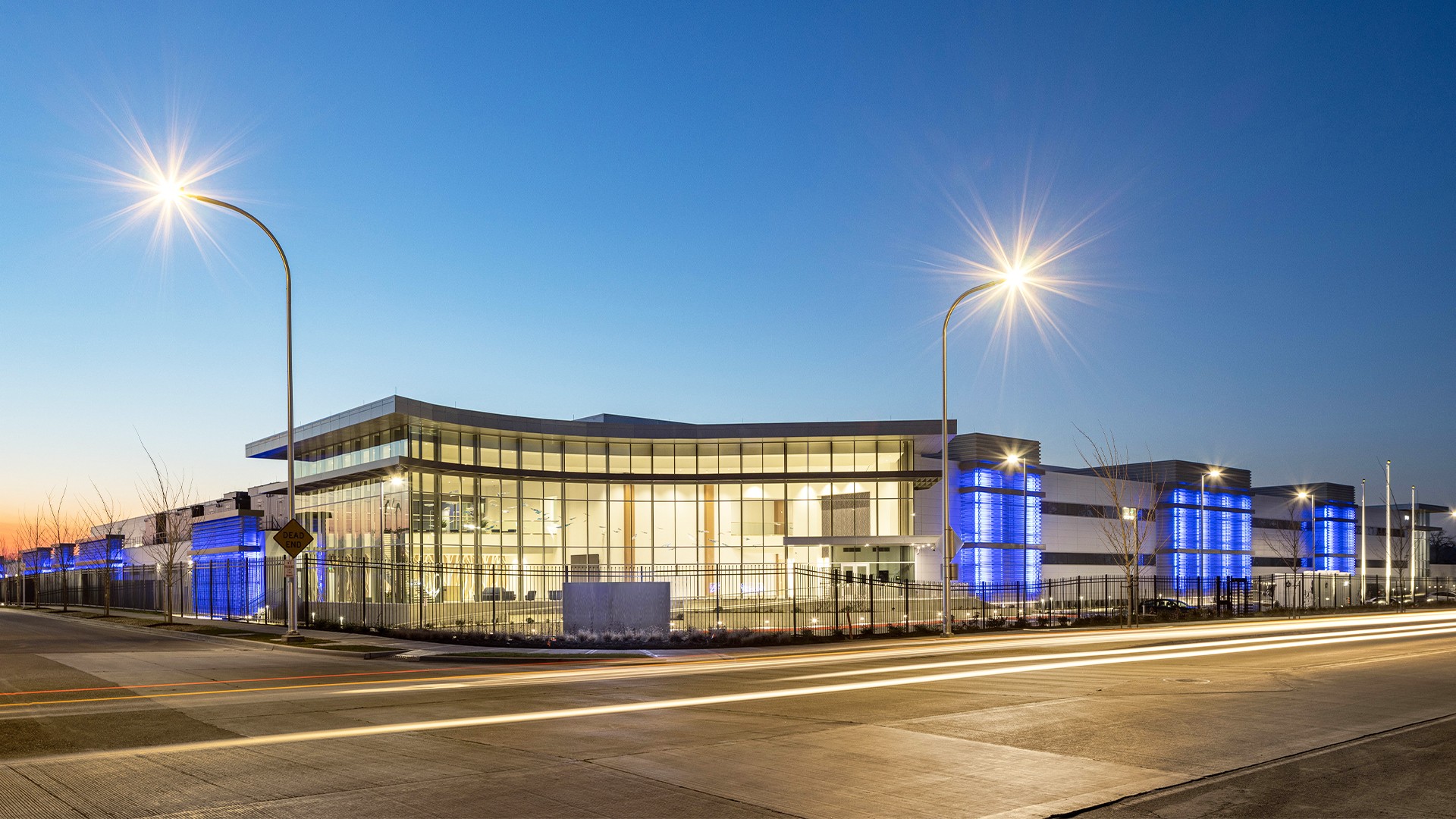 Spacious Empty Data Center with Grid Ceiling Design Exterior shot of data center at dusk
