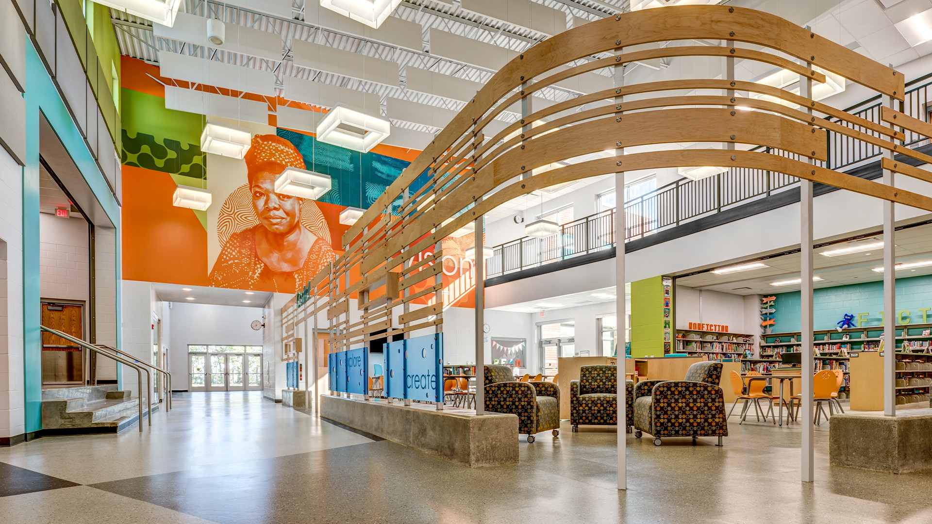 School Library Interior with Wooden Ceiling and Bookshelves Modern library interior with colorful walls, seating areas, and natural light.