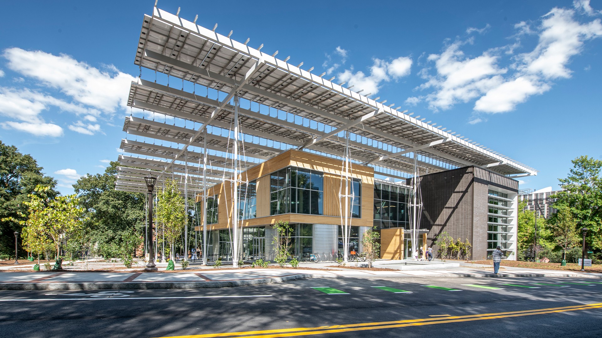 Education lab with Orange Chairs and Advanced Equipment Exterior shot of an academic building with vibrant green trees in the background