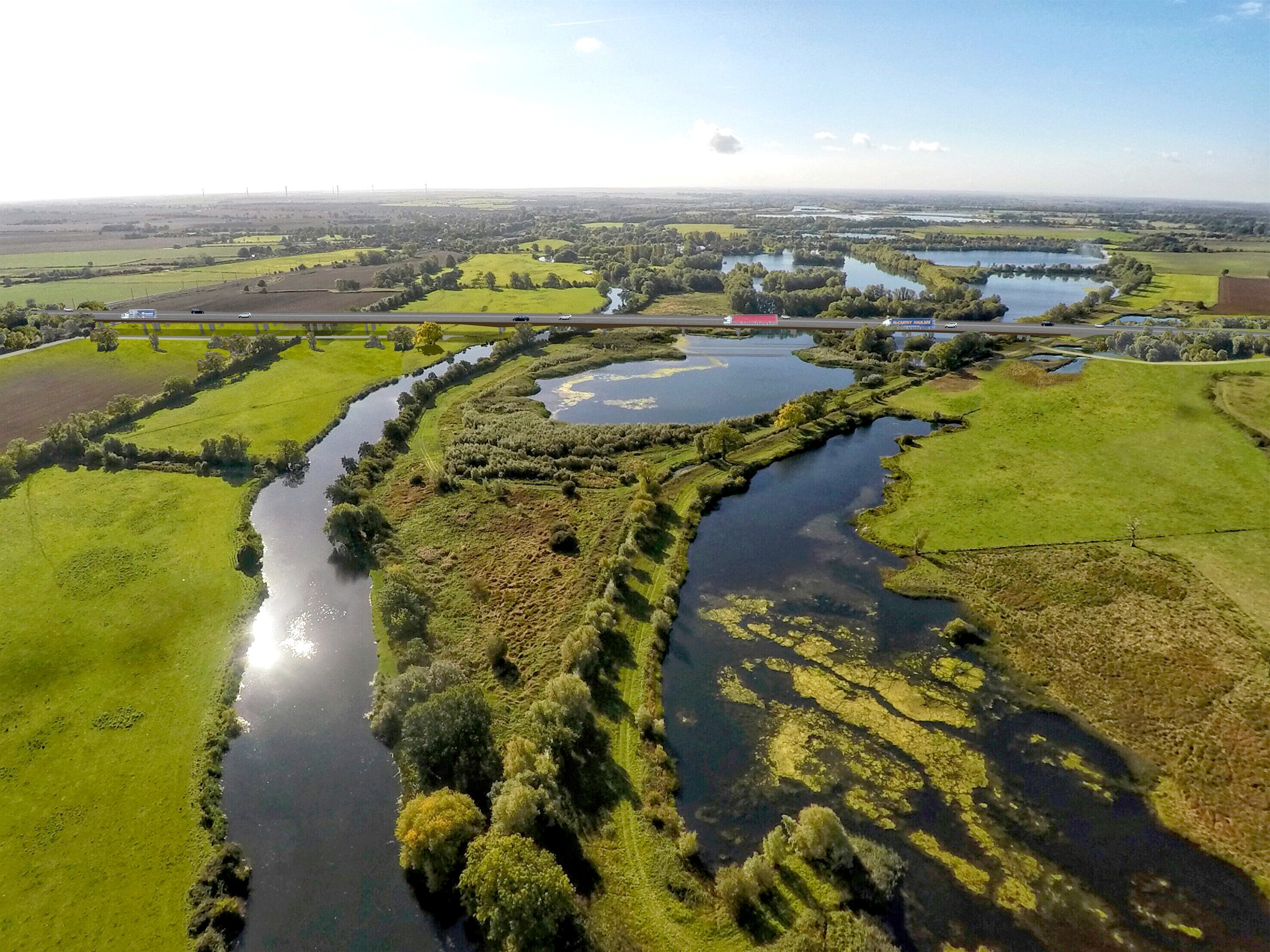 Scenic Riverside Landscape with Lush Greenery and Waterways Aerial view of a lush river landscape with winding waterways and vibrant green fields.