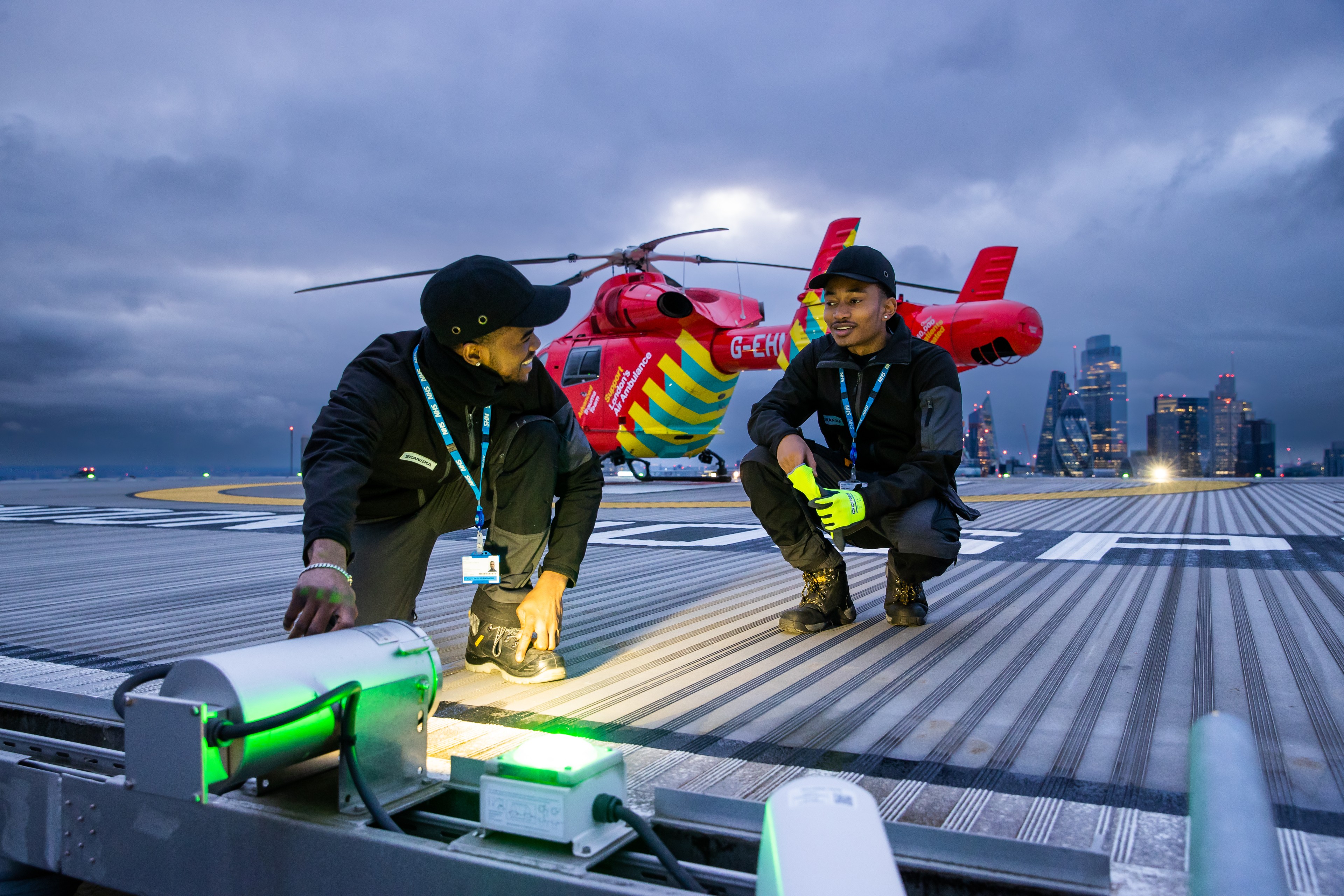 Skanska colleagues inspect the helipad for London's Air Ambulance at Royal London Hospital