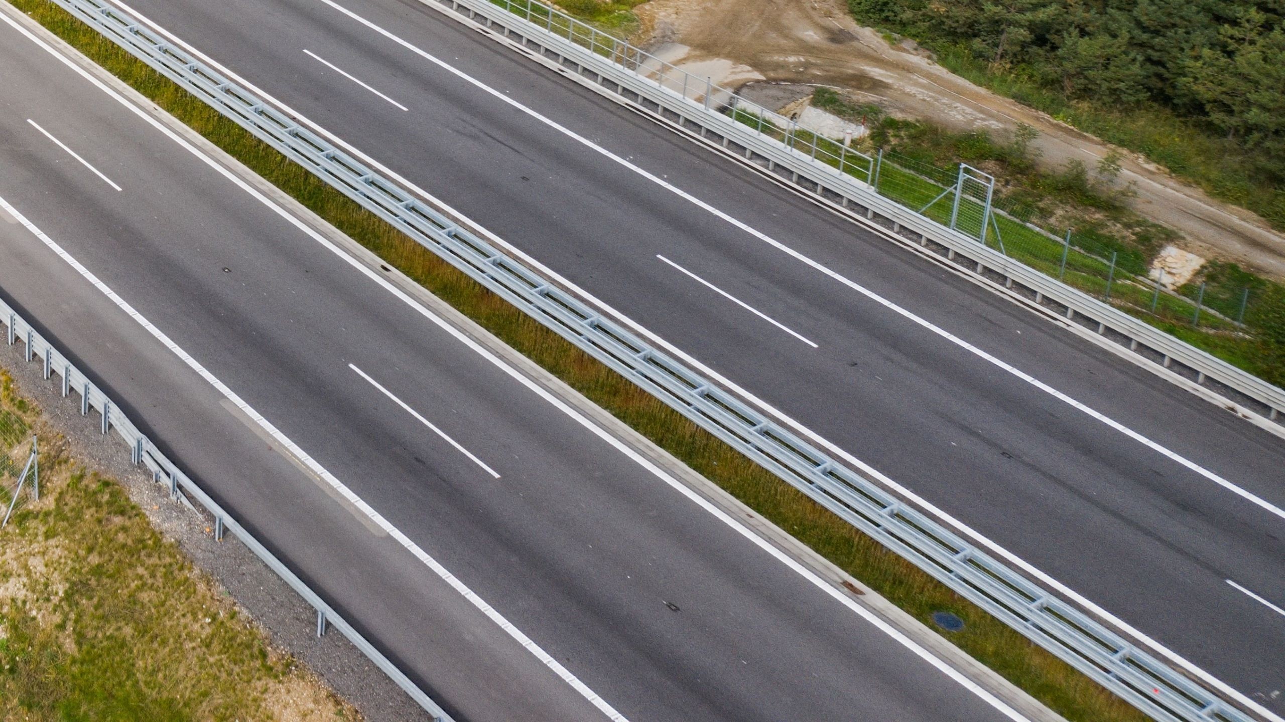 Aerial view of a complex highway interchange with roundabouts and multiple lanes.
