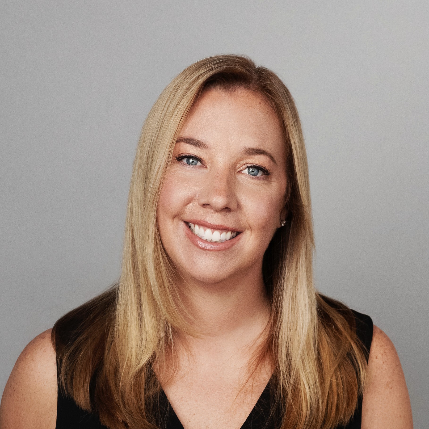 Tieg poses in black dress for professional headshot. Tieg poses in black dress for professional headshot.