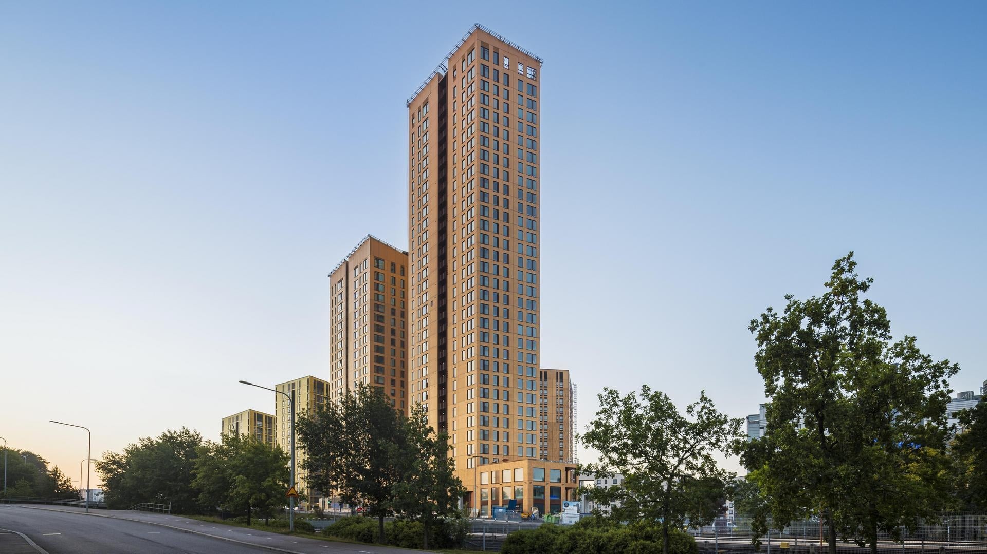 The 24-story Hyperion and the 33-story Atlas are new landmarks of eastern Helsinki. Two bronze-colored tower buildings.