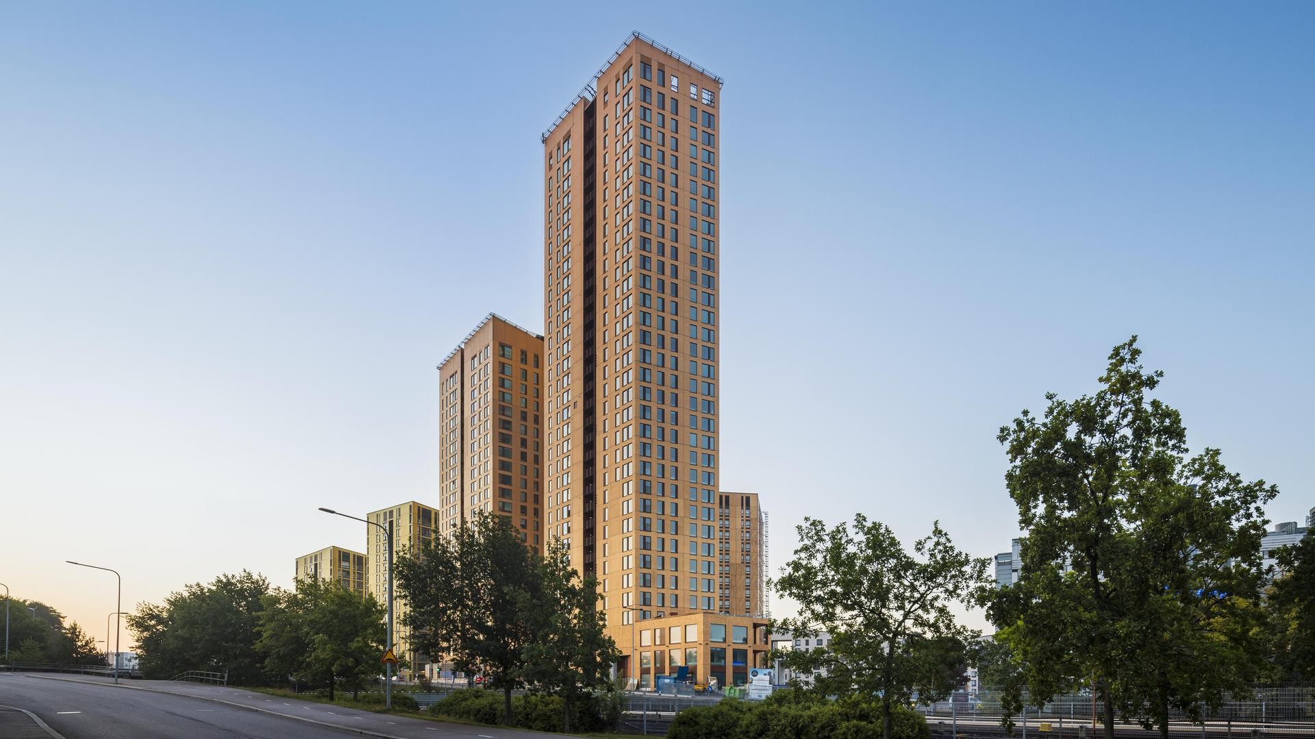 The 24-story Hyperion and the 33-story Atlas are new landmarks of eastern Helsinki. Two bronze-colored tower buildings.