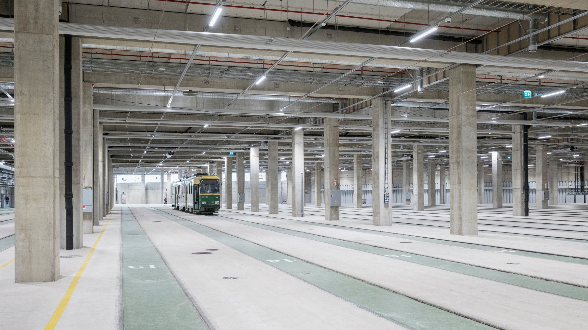 Finland's first combined tram and bus depot was built in the area of the bus depot previously located in Ruskeasuo. Depot photographed with a drone, buses on the roof.