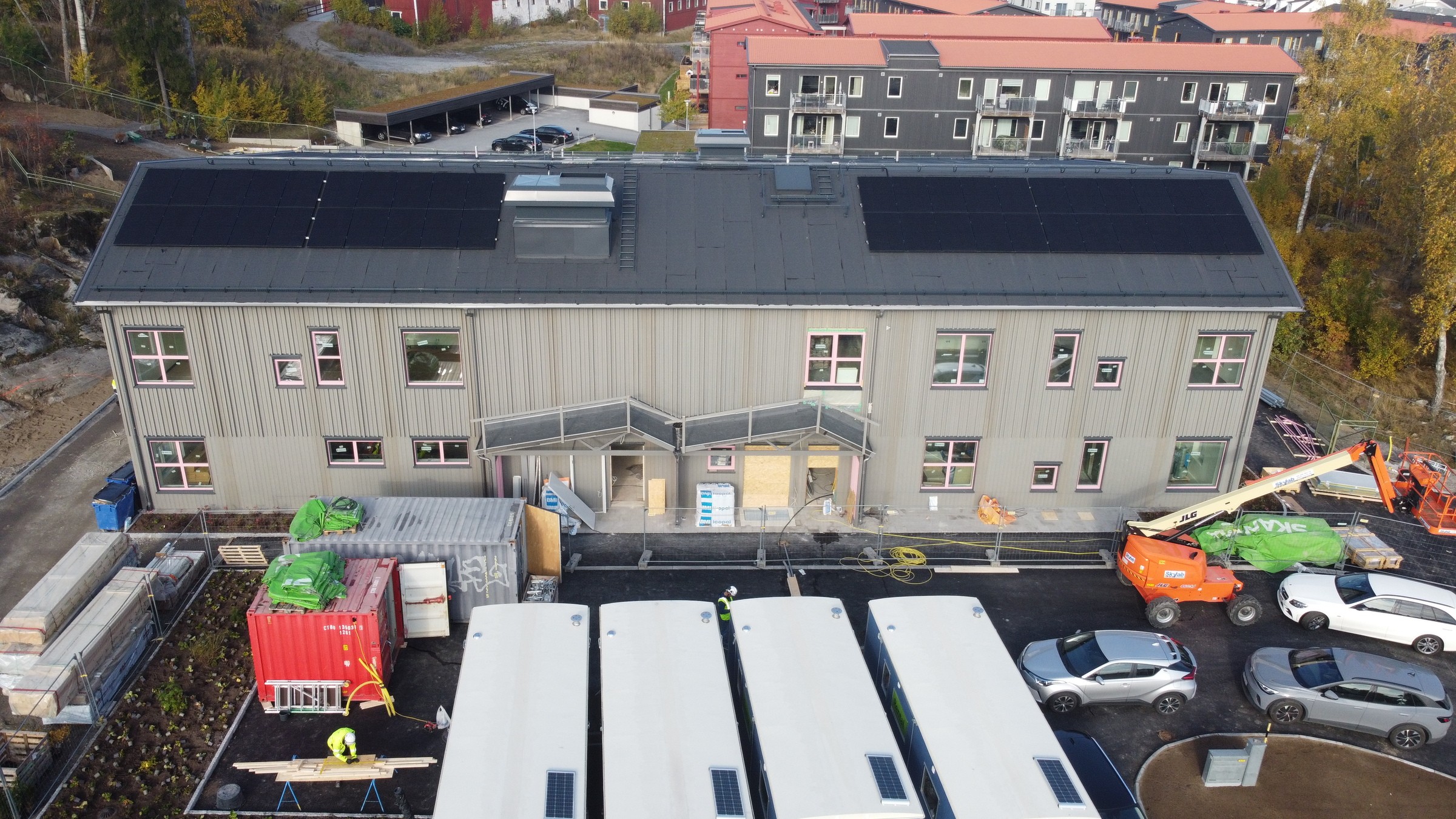 Image of the building, showing the solar panels on the roof.