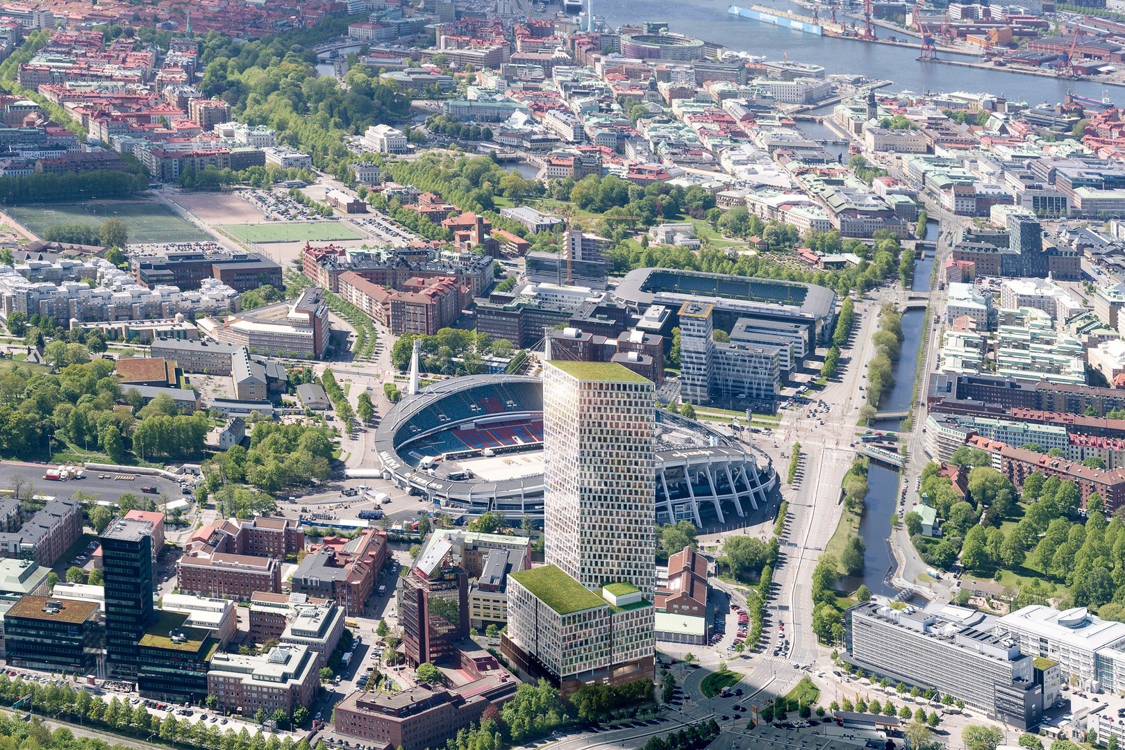 Aerial view of Gothenburg featuring a prominent stadium surrounded by urban buildings and greenery.
