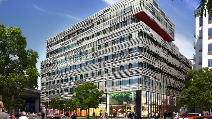Modern multi-story building with striped facade, large windows, and bustling street activity.
