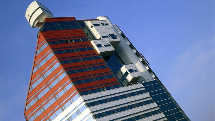 Lilla Bommen A modern skyscraper with a unique angular design featuring red and white geometric patterns.