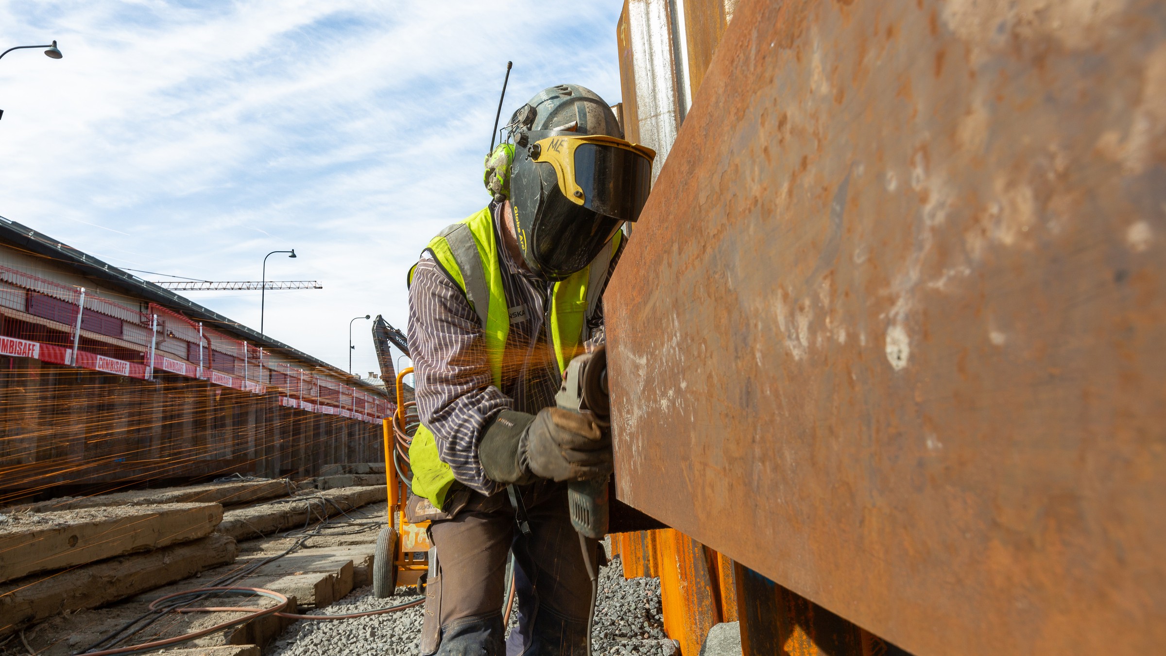 A man renovating steel construction during phase one.