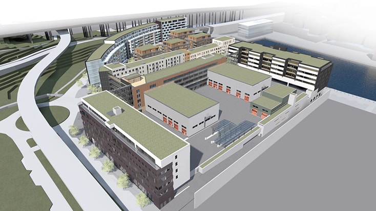 Integrating the bus depot into the urban environment is a key aspect of the project. Aerial view of a modern urban development featuring mixed-use buildings and landscaped areas.