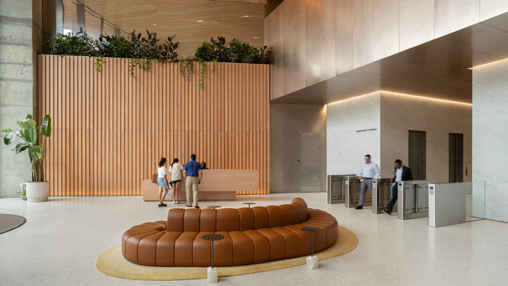 16x9 Aspect Ratio: 1920x1080 Resolution Template Design Modern lobby with circular seating, wooden accents, and people at a reception desk.