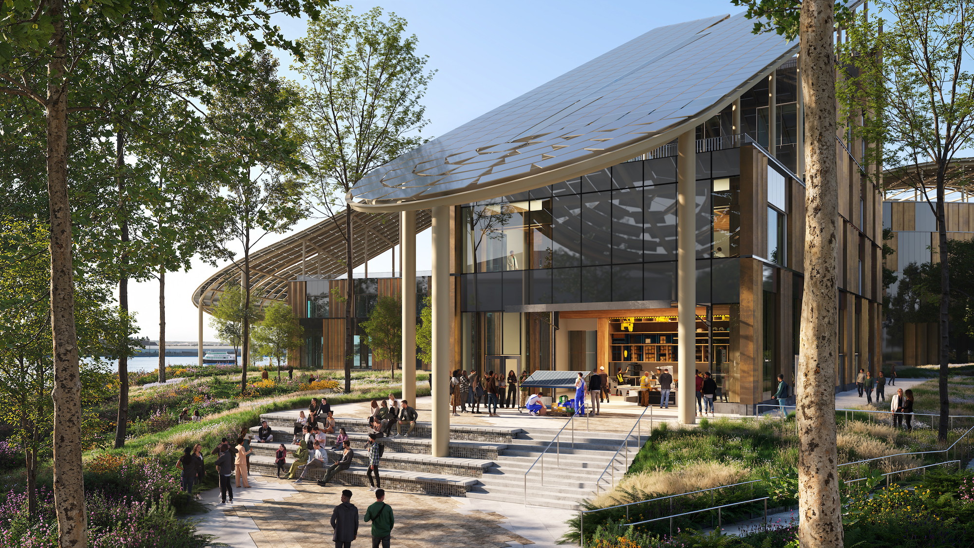 Modern Sustainable Building with Outdoor Seating and Greenery Modern eco-friendly building with large glass windows and outdoor seating area surrounded by trees.