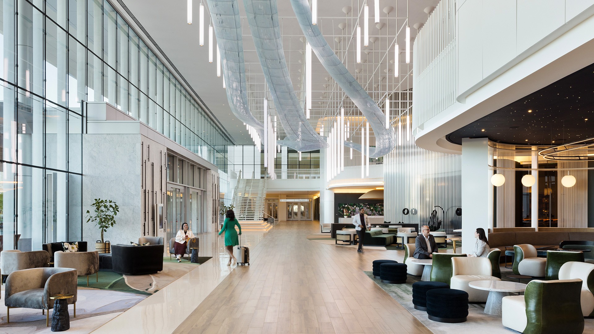 Modern, bright and large hotel lobby with guests