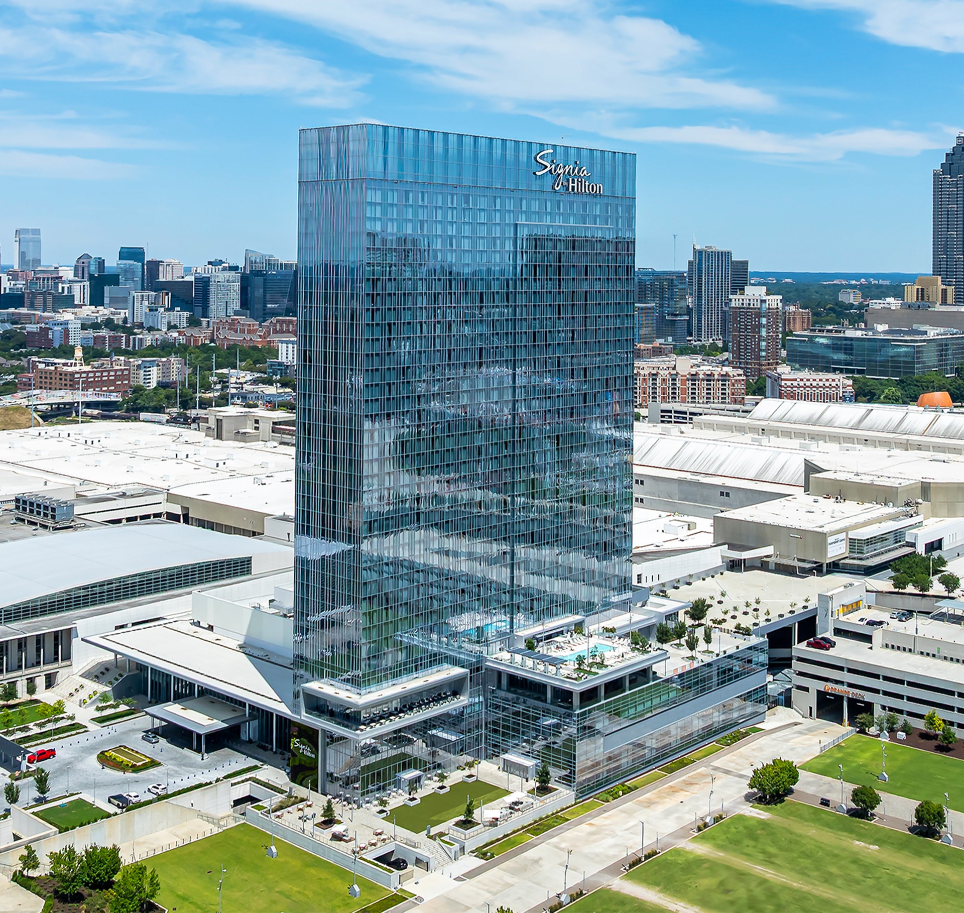 Modern Signia Hilton Hotel Tower in Urban Cityscape View Aerial view of the modern Signia Hilton hotel tower with glass facade in a cityscape.