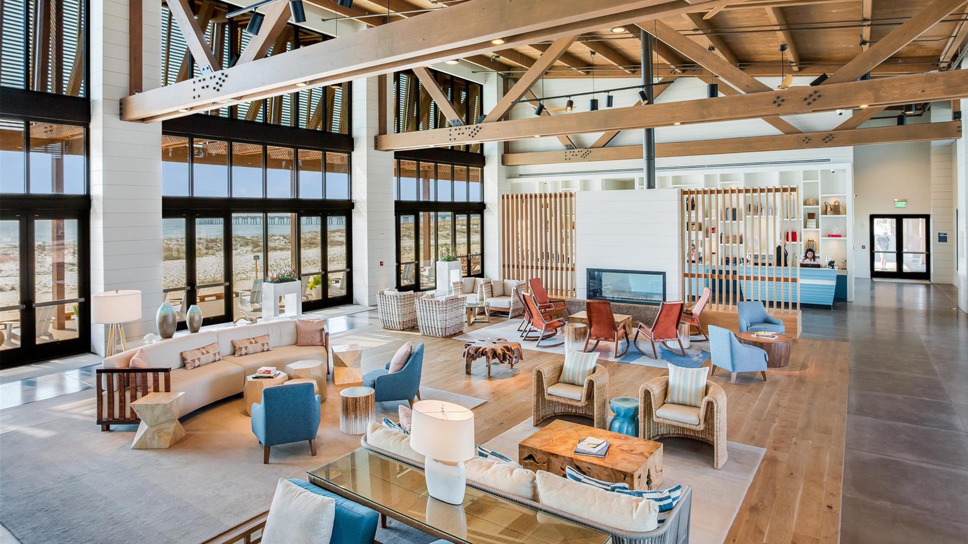 Modern Spacious Living Room with Wooden Beams and Large Windows Spacious modern living room with large windows, wooden beams, and comfortable seating.