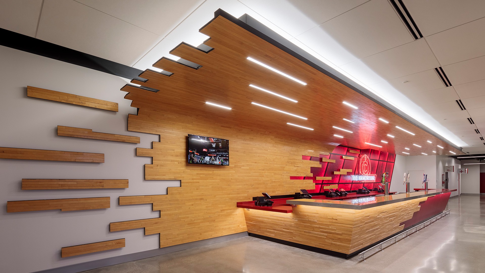 Modern reception desk with wood paneling, LED lighting, and a sleek minimalist design.