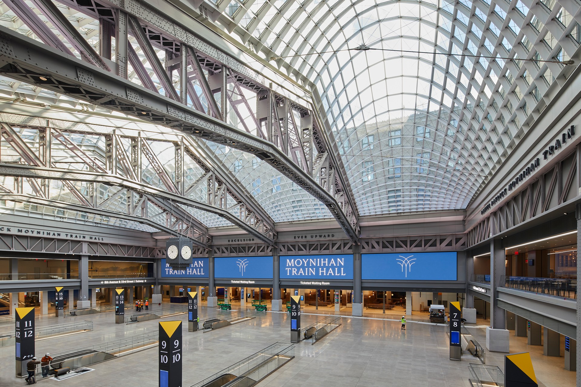Moynihan Train Hall Interior: Modern Architecture Design Interior of Moynihan Train Hall featuring expansive glass ceiling and modern architectural design.