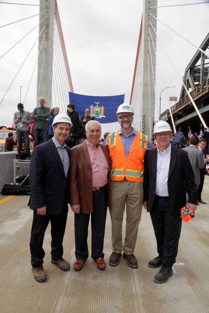 (From Left to Right) Mike Viggiano, Executive Vice President of Skanska USA Civil; Rich Lombardi, Senior Vice President of ECCO III; Larry Gillman, Vice President of Operations and Project Director of Skanska USA Civil; and Keith Chouinard, Senior Vice President and General Manager of Skanska USA Civil Northeast celebrate the opening of the Queens-bound span of the new Kosciuszko Bridge. (From Left to Right) Mike Viggiano, Executive Vice President of Skanska USA Civil; Rich Lombardi, Senior Vice President of ECCO III; Larry Gillman, Vice President of Operations and Project Director of Skanska USA Civil; and Keith Chouinard, Senior Vice President and General Manager of Skanska USA Civil Northeast celebrate the opening of the Queens-bound span of the new Kosciuszko Bridge.