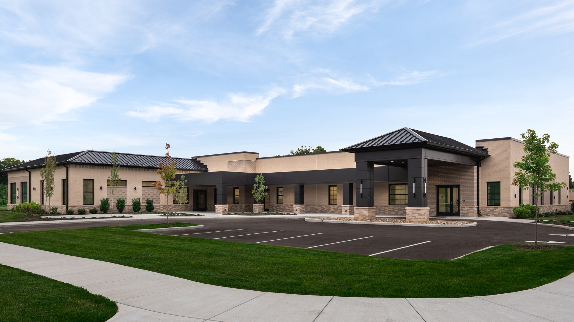 New South Central Regional Health Office Modern single-story commercial building with parking lot and landscaped lawn.