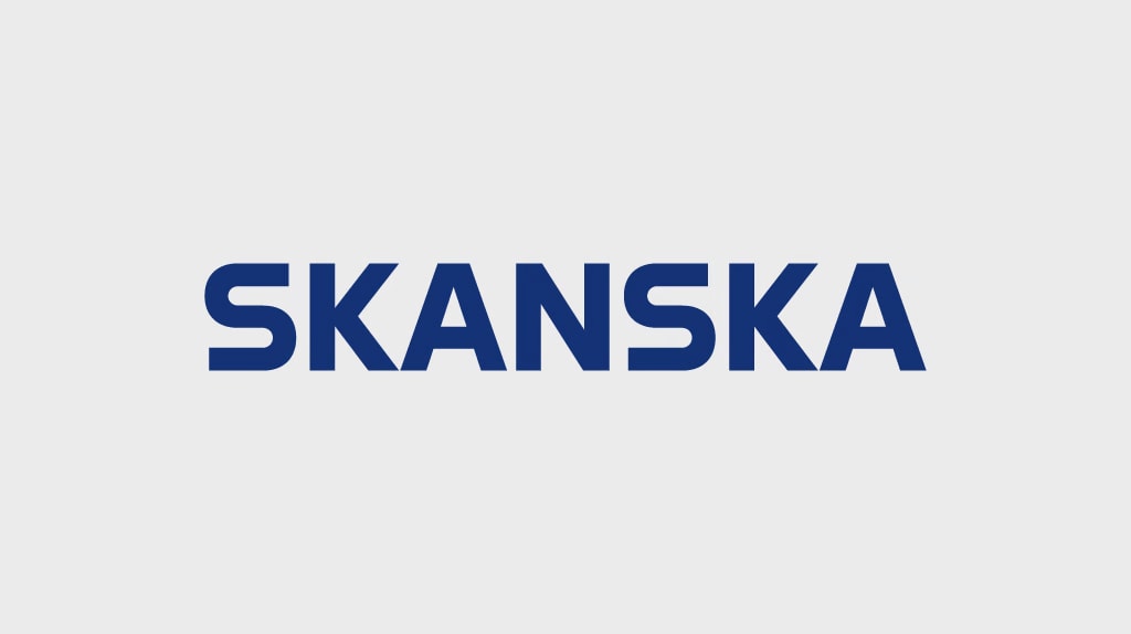 Blue Skanska logo on a light gray background, representing construction and development.