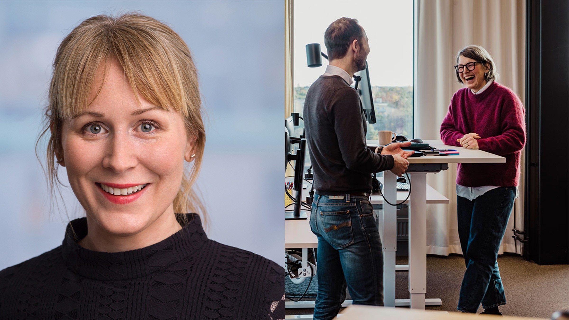 Två kollegor har en diskussion stående vid ett skrivbord i ett modernt kontorsutrymme.