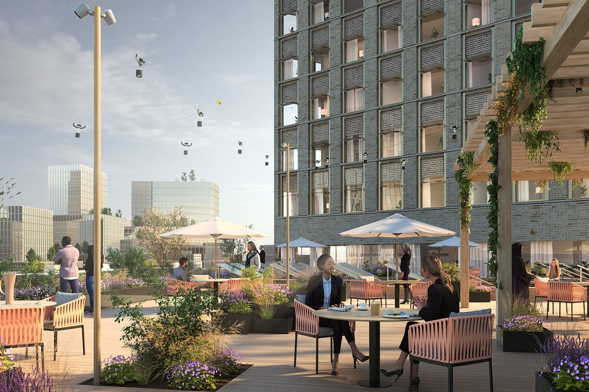 Modern takterrass med människor som äter, omgivna av urban grönska och flygande drönare.