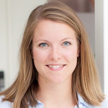 Elin Ulvan A person with shoulder-length blonde hair wearing a light blue shirt in a well-lit indoor environment.