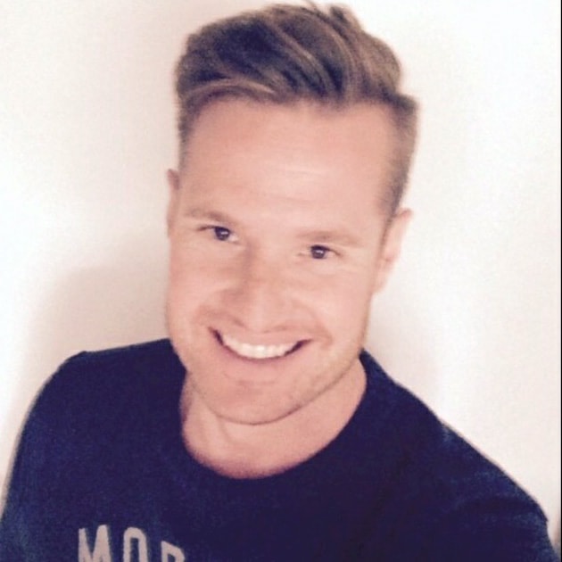 Peter Fors Person wearing a "Morris" sweater, with short, styled hair against a simple white background.
