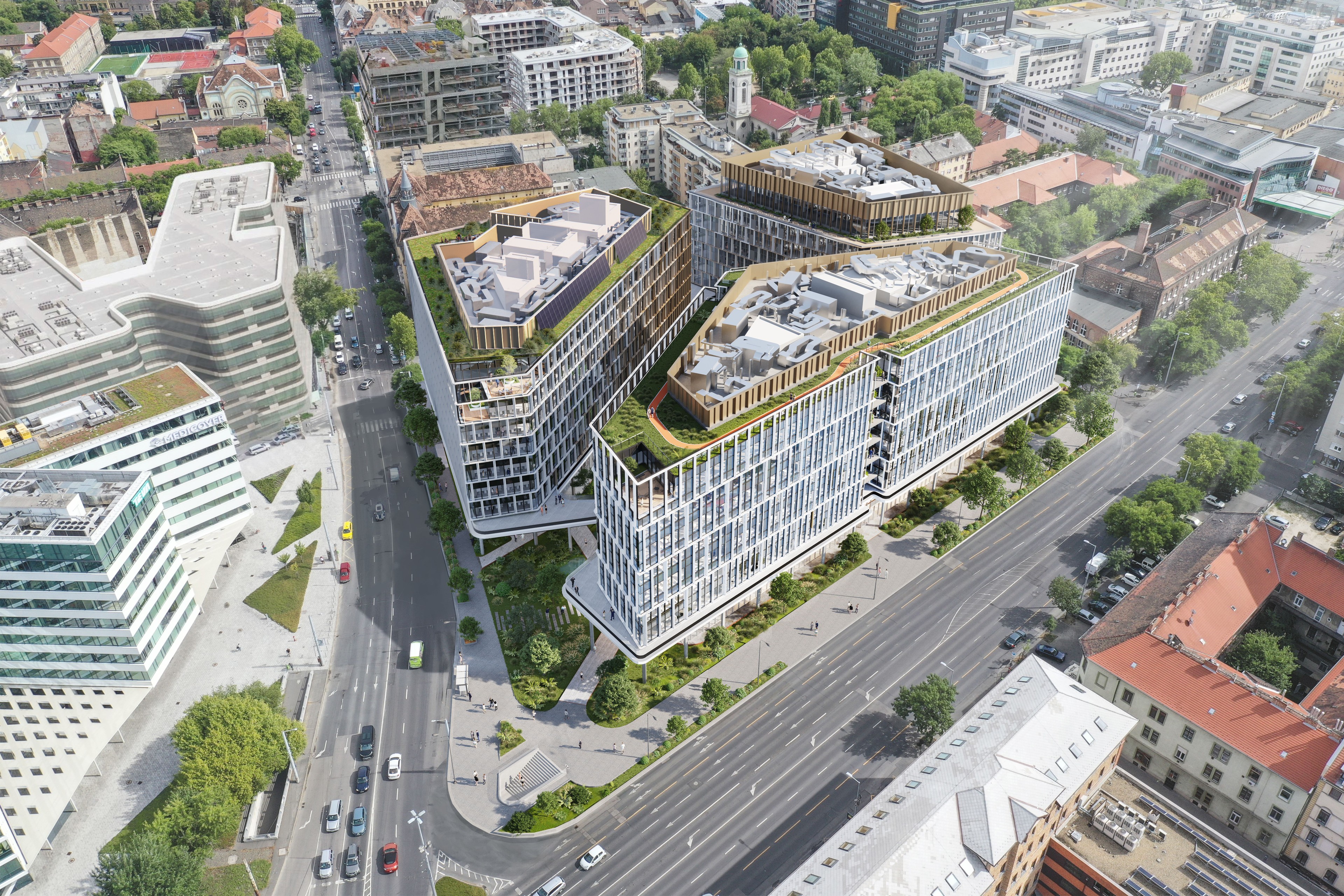 H₂Offices Phase 3 H₂Offices Phase 3, a modern office buildings with glass facades on a sunny day, surrounded by cars and greenery.