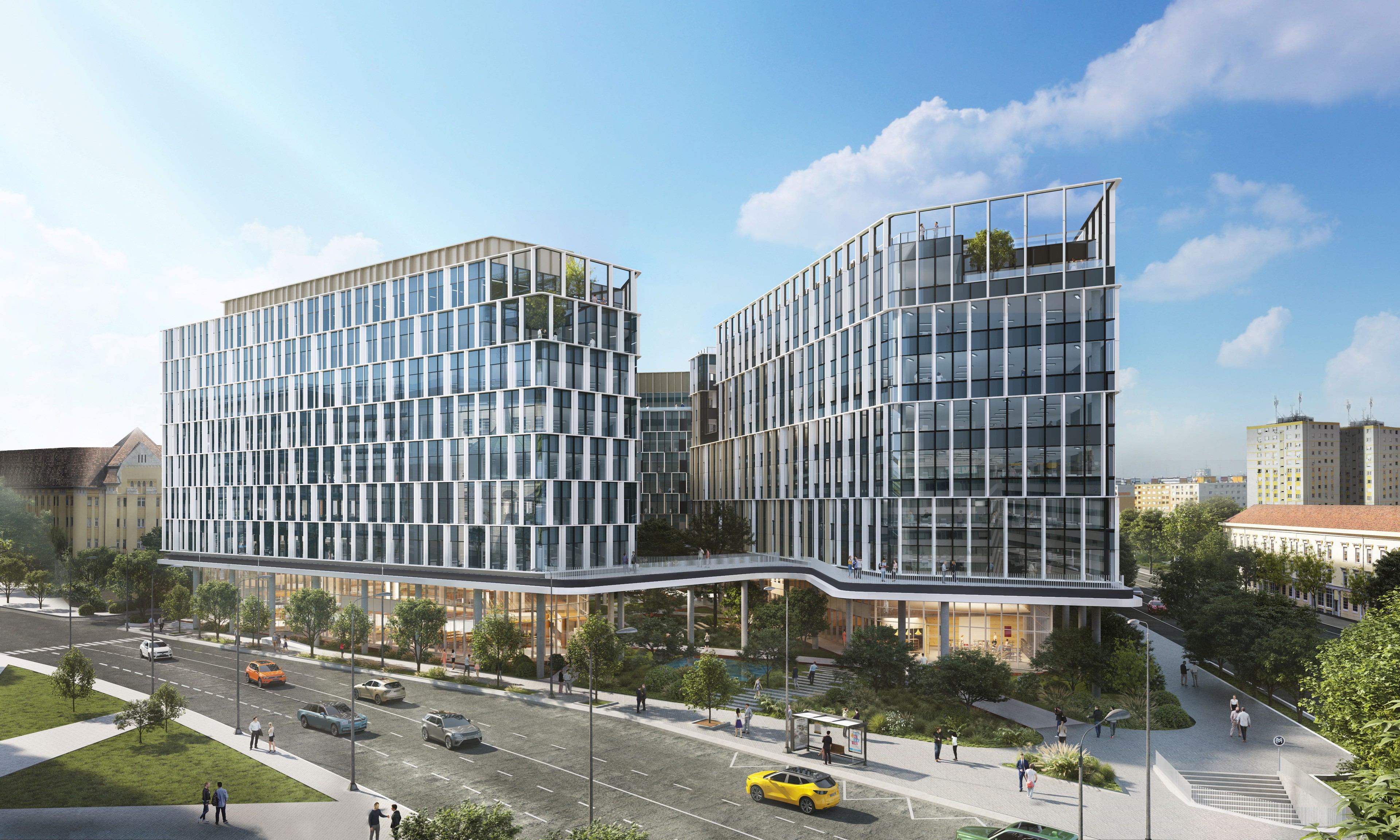 H₂Offices phase 1 Modern office buildings with glass facades in a cityscape, surrounded by trees and roads.