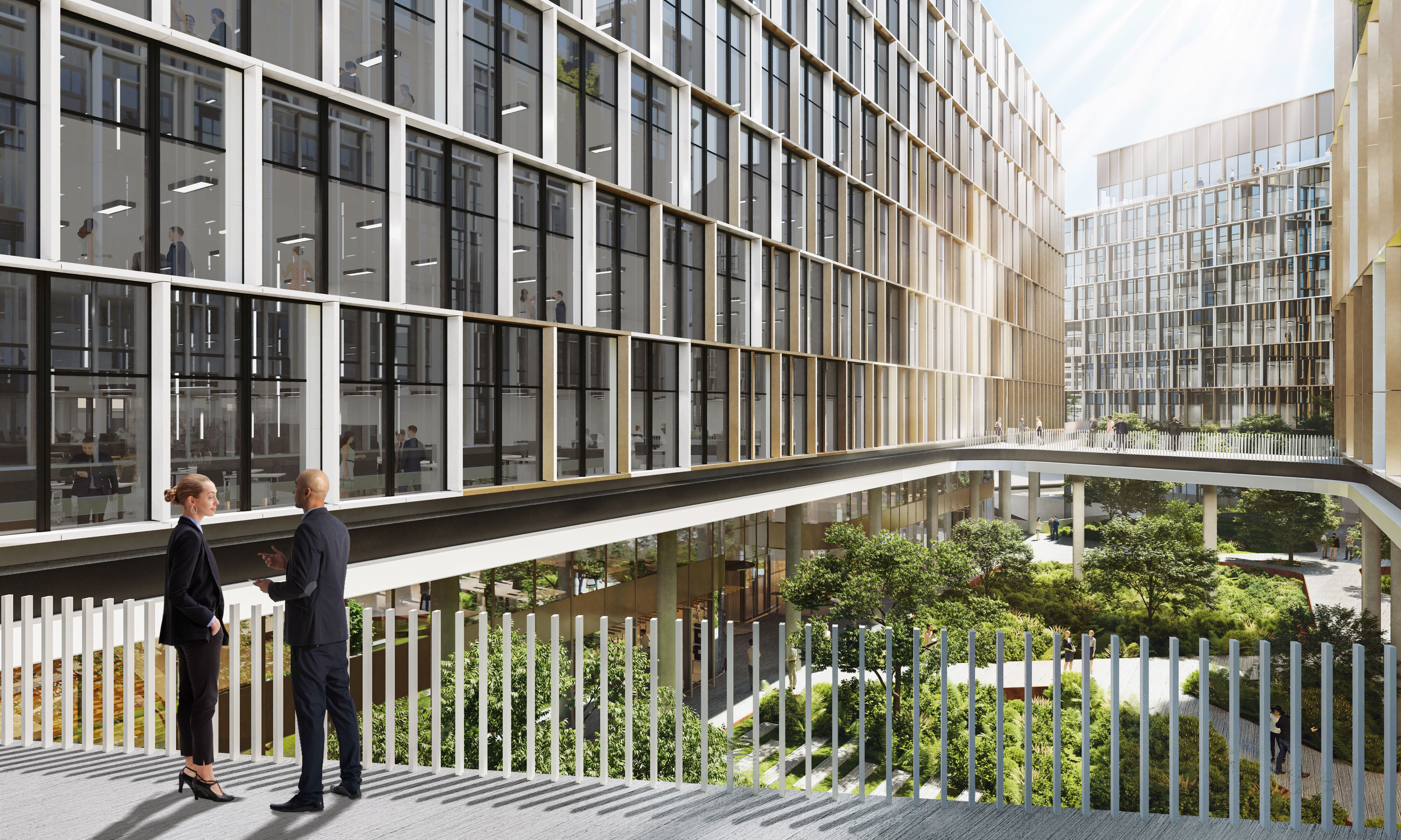 Modern office buildings with glass facades surround a green courtyard where two people converse.