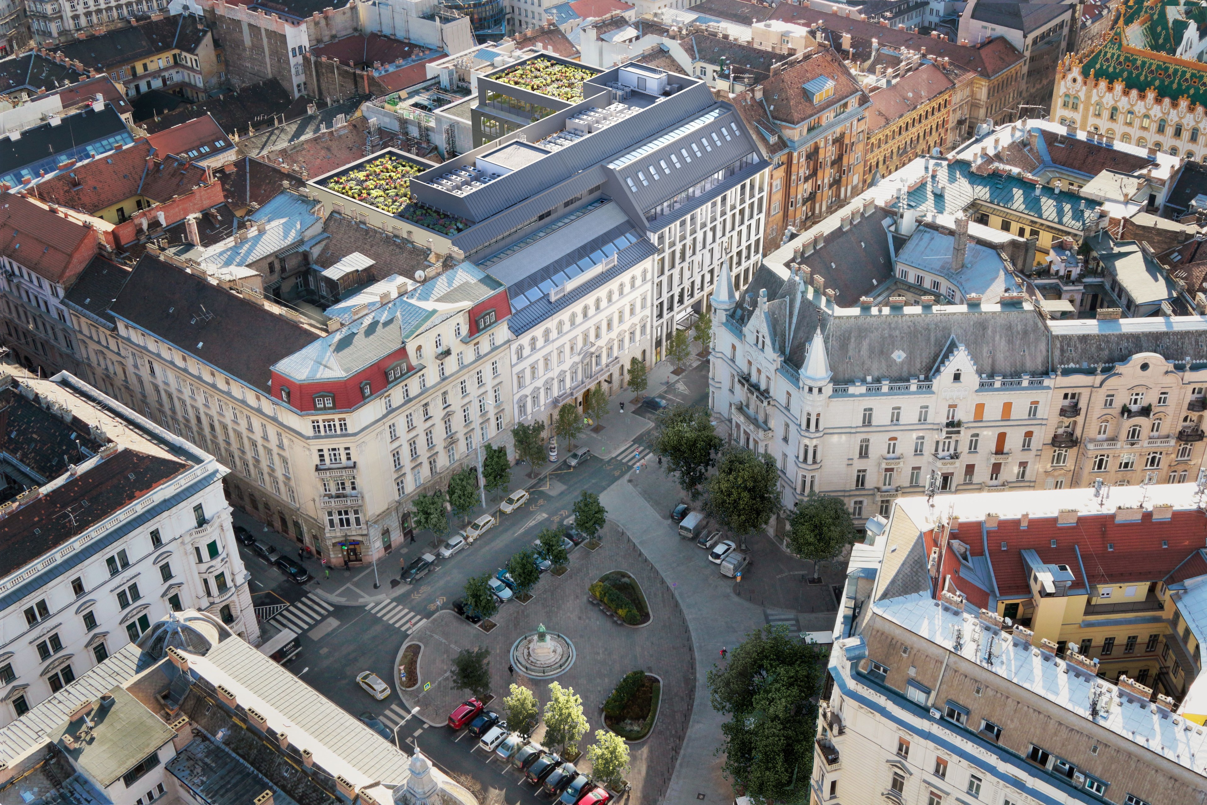 Aerial view of a European city square surrounded by historic buildings and parked cars.