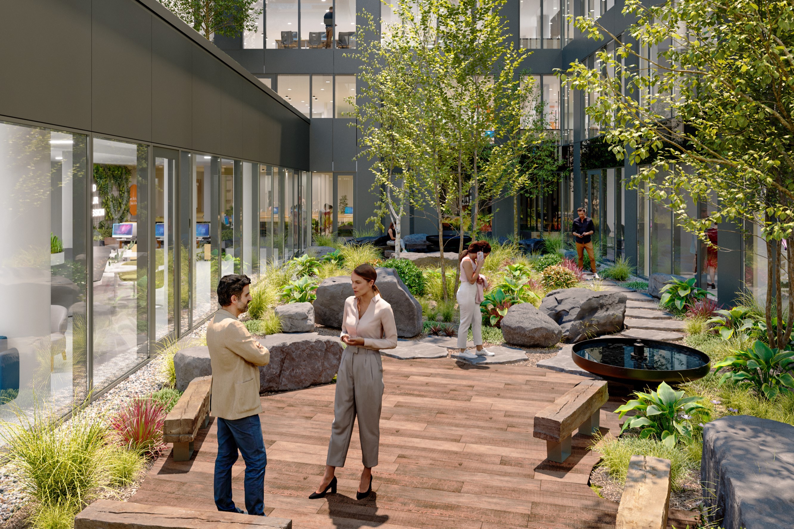 HOLD courtyard Modern office courtyard with people talking, greenery, and large windows.