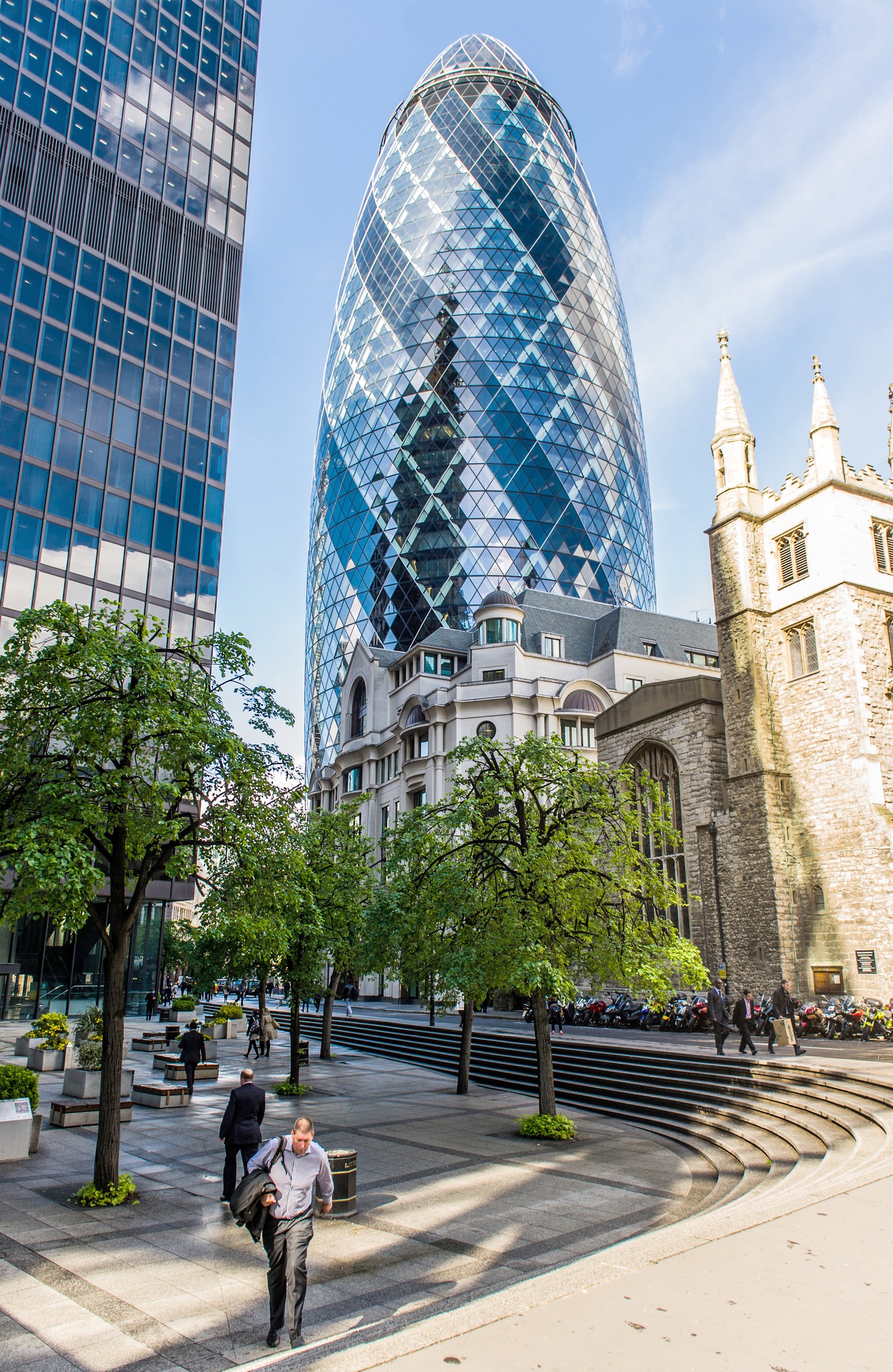 The Gherkin The Gherkin skyscraper in London's financial district surrounded by modern and historical buildings.