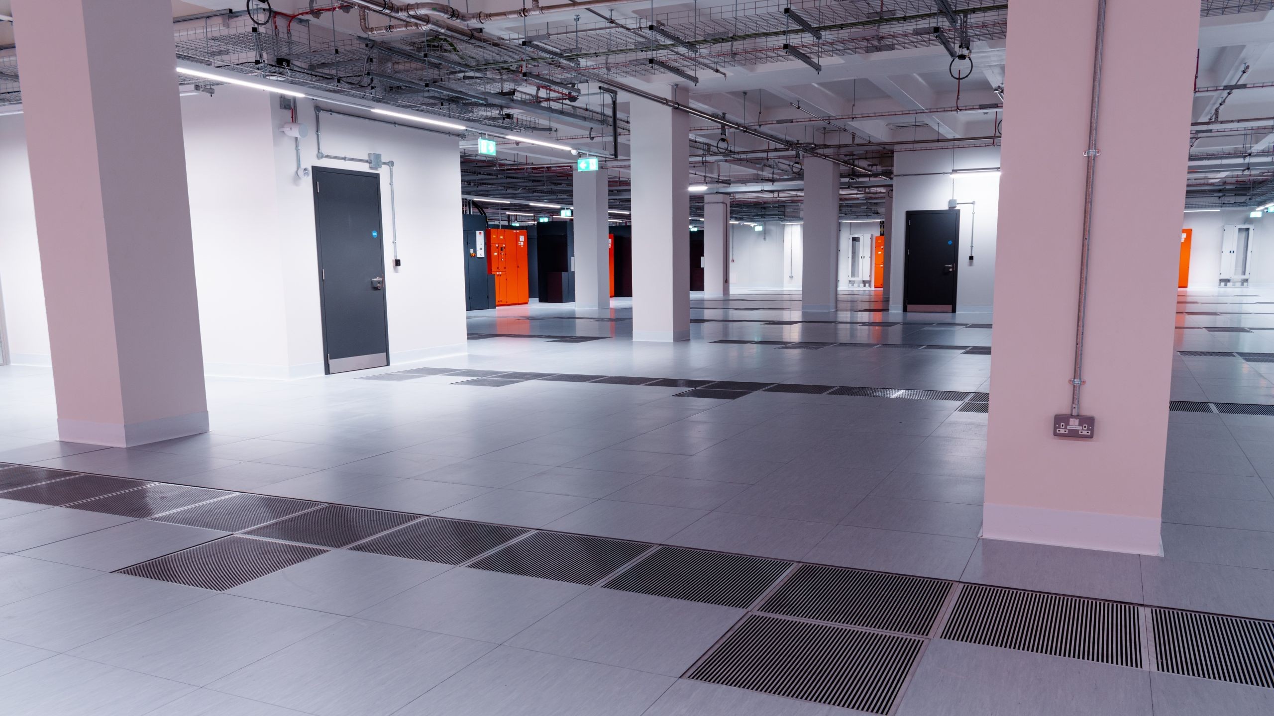 Data centre interior Data centre interior showing floor, pillars, and overhead lighting.