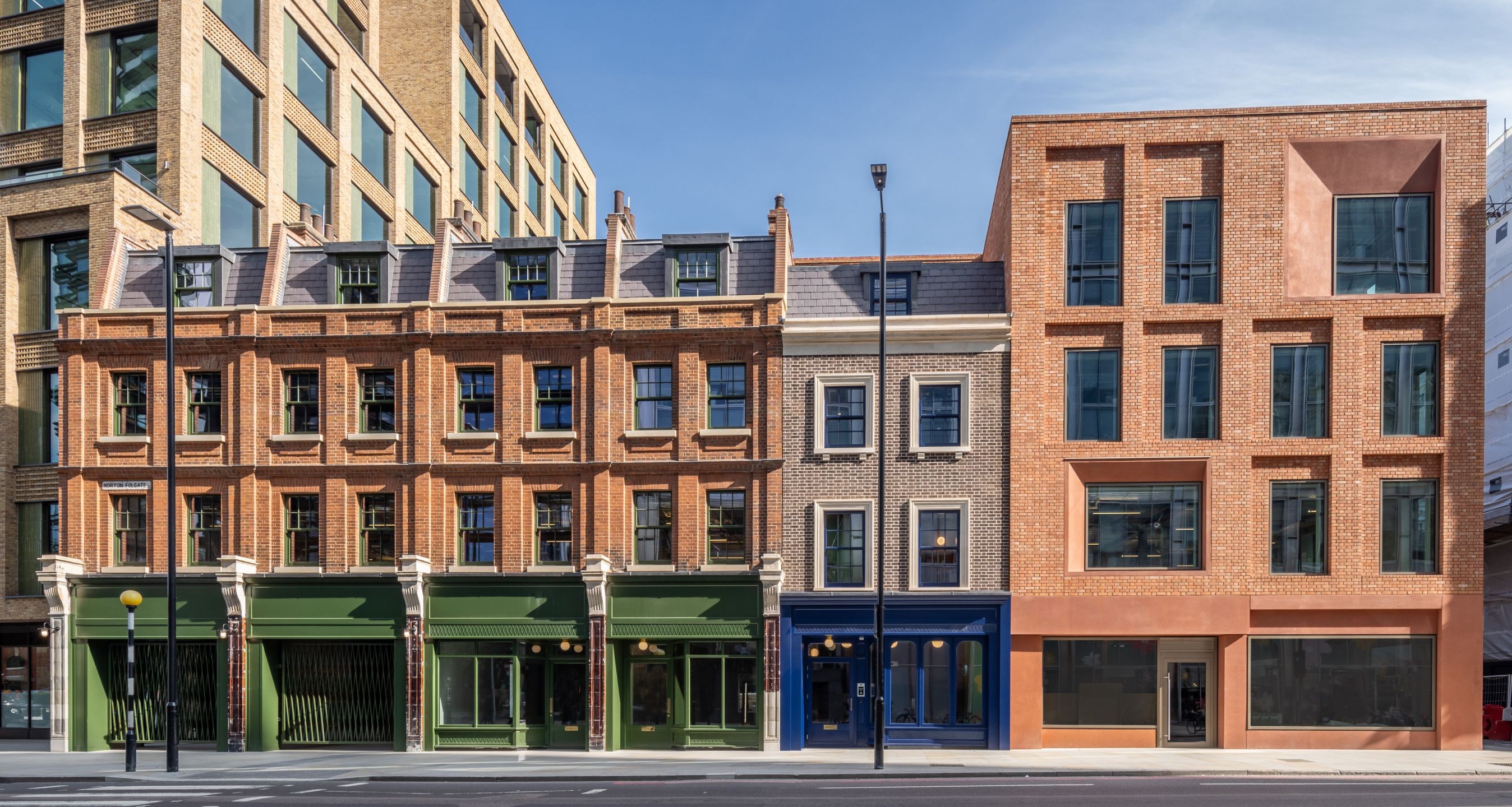 Norton Folgate Row of commercial properties with coloured shopfronts.