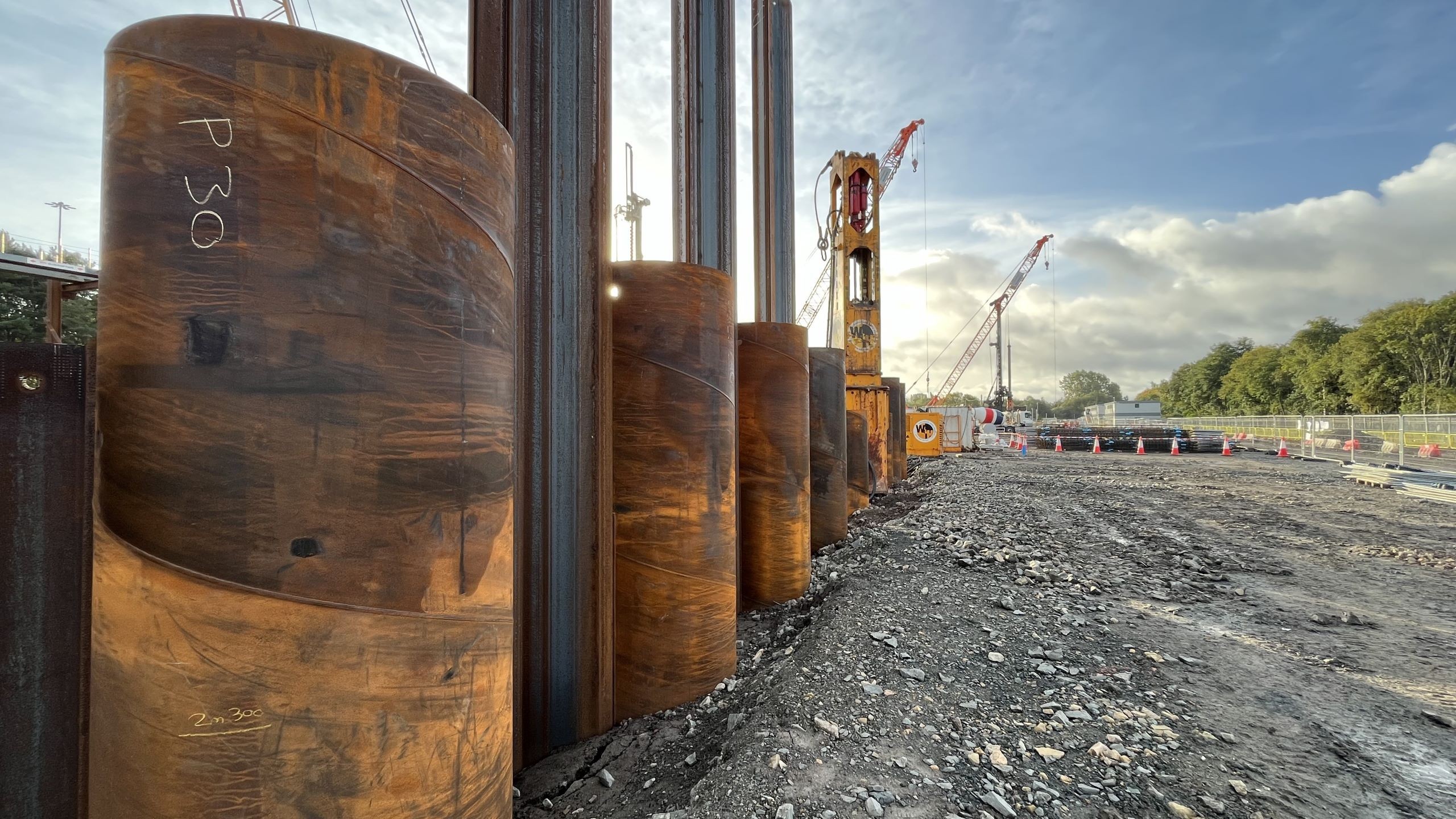 Construction Site with Steel Piles and Cranes in Action South Clyde Energy Centre, Glasgow