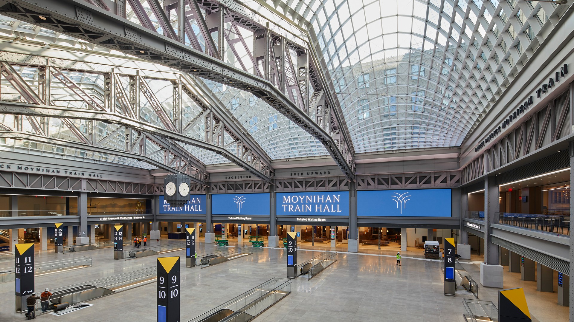 Moynihan Train Hall Interior: Modern Architecture Design Interior of Moynihan Train Hall featuring expansive glass ceiling and modern architectural design.