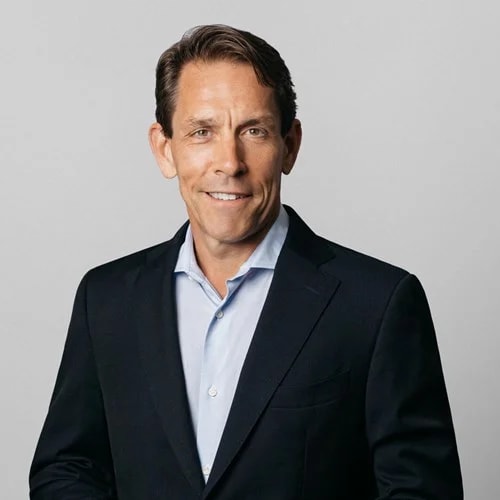 President & CEO, Skanska USA Richard Kennedy Richard Kenney in a black suit and light blue shirt poses against a neutral gray background.