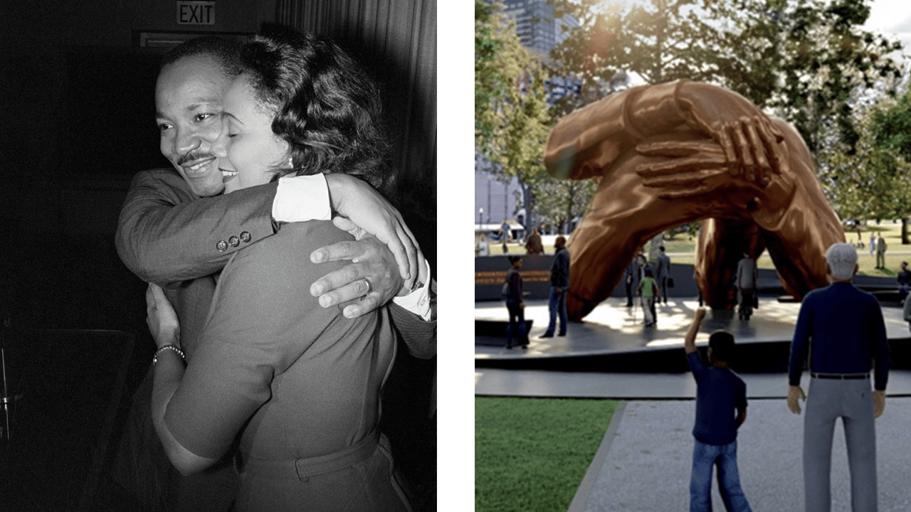 Two people embracing warmly in black and white next to a large bronze hand sculpture outdoors.