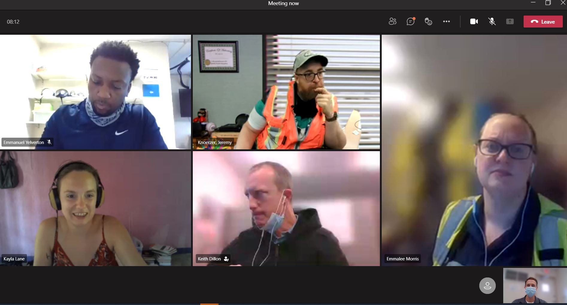 Five professionals wearing safety vests in a virtual team meeting on Microsoft Teams.