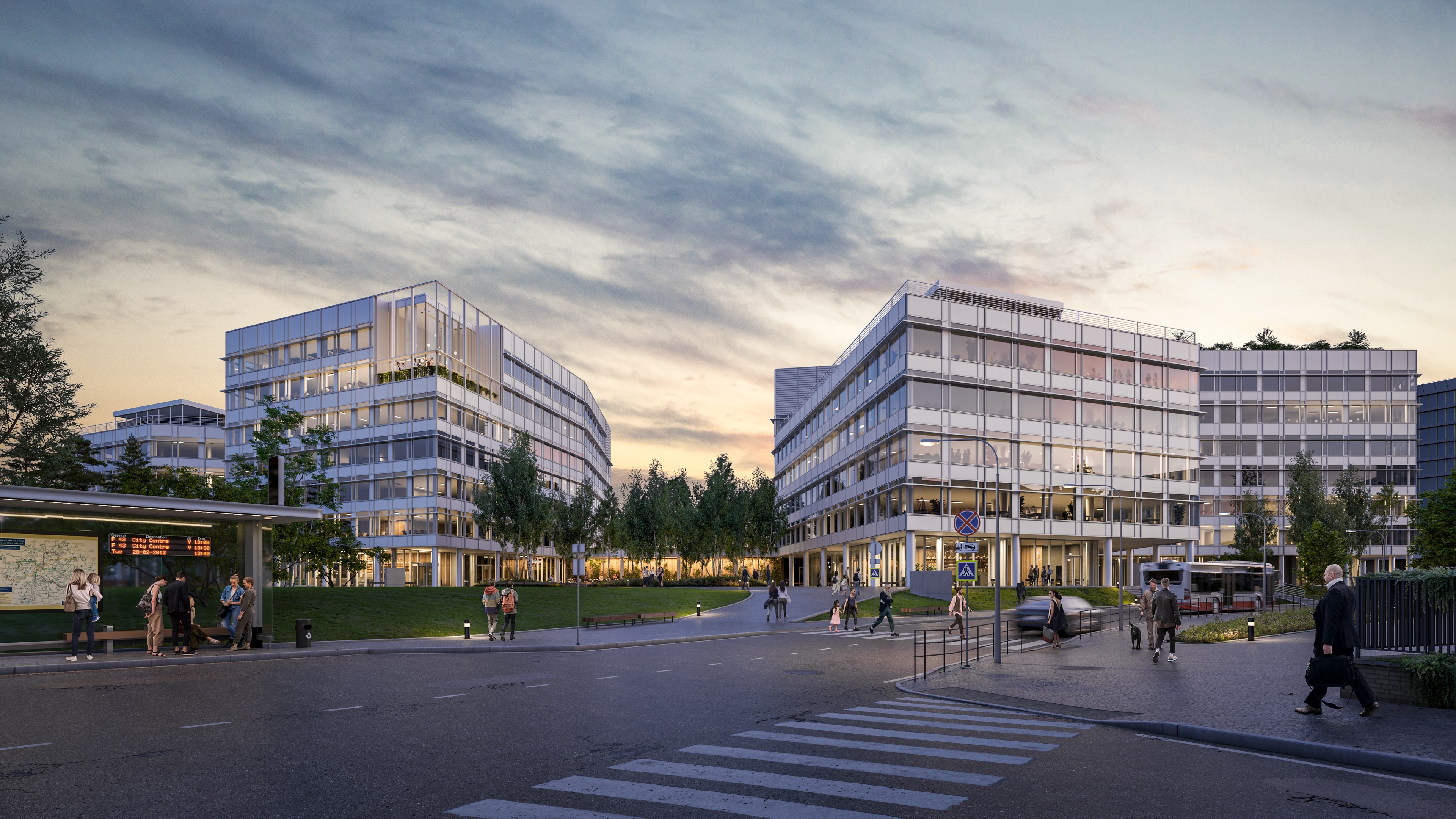 Key from Sdružení street Modern glass office buildings with people walking near the pedestrian crossing at dusk.