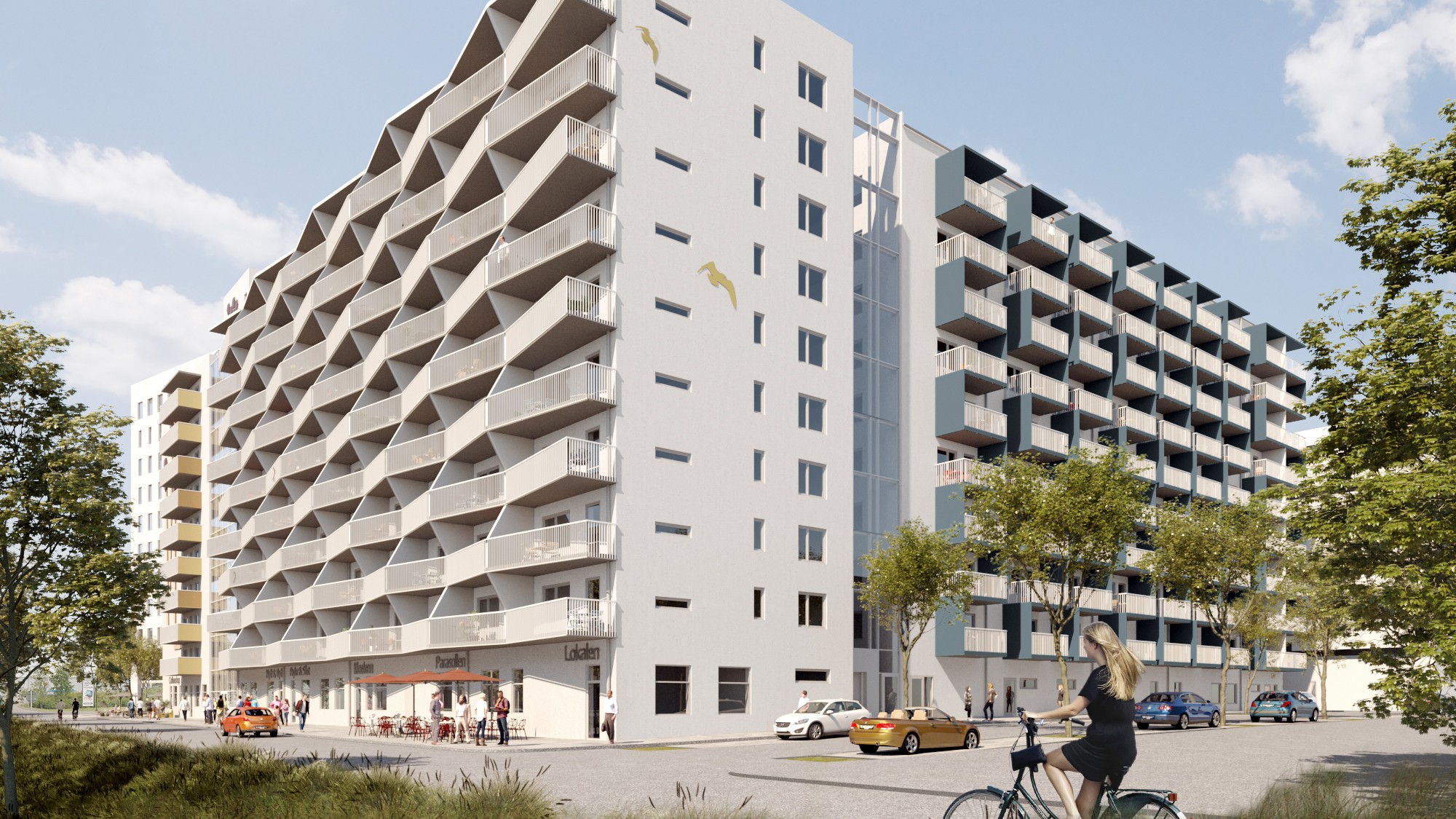 Bostadskvarteret Tändstickan i södra Göteborg. Modernt urbant lägenhetskomplex med distinkta balkonger och gatunivåaktivitet.