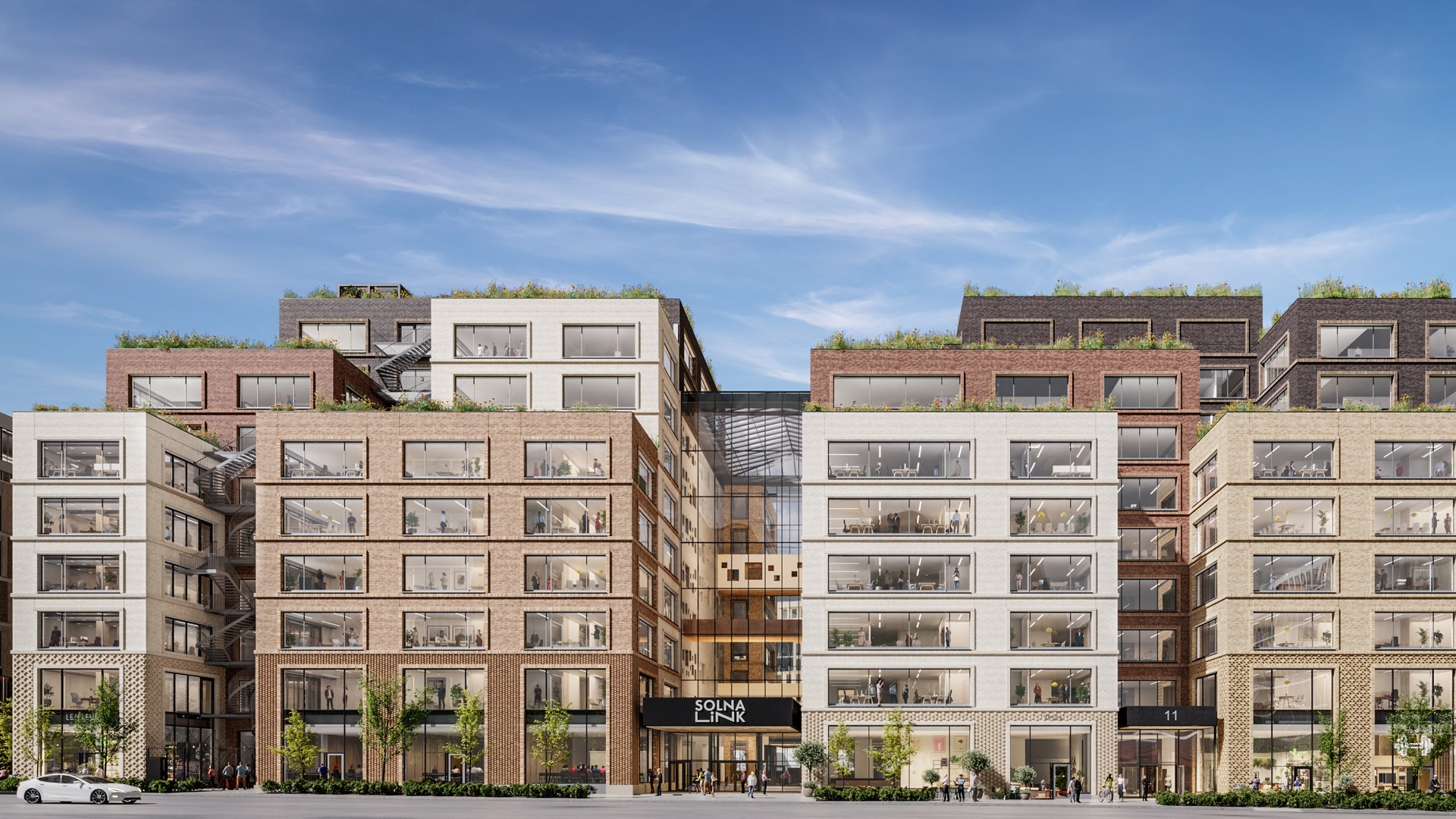 I Arenastaden, intill Solna station, bygger Skanska kontorsfastigheten Solna Link. Solna Link fasaden från Gårdsvägen.