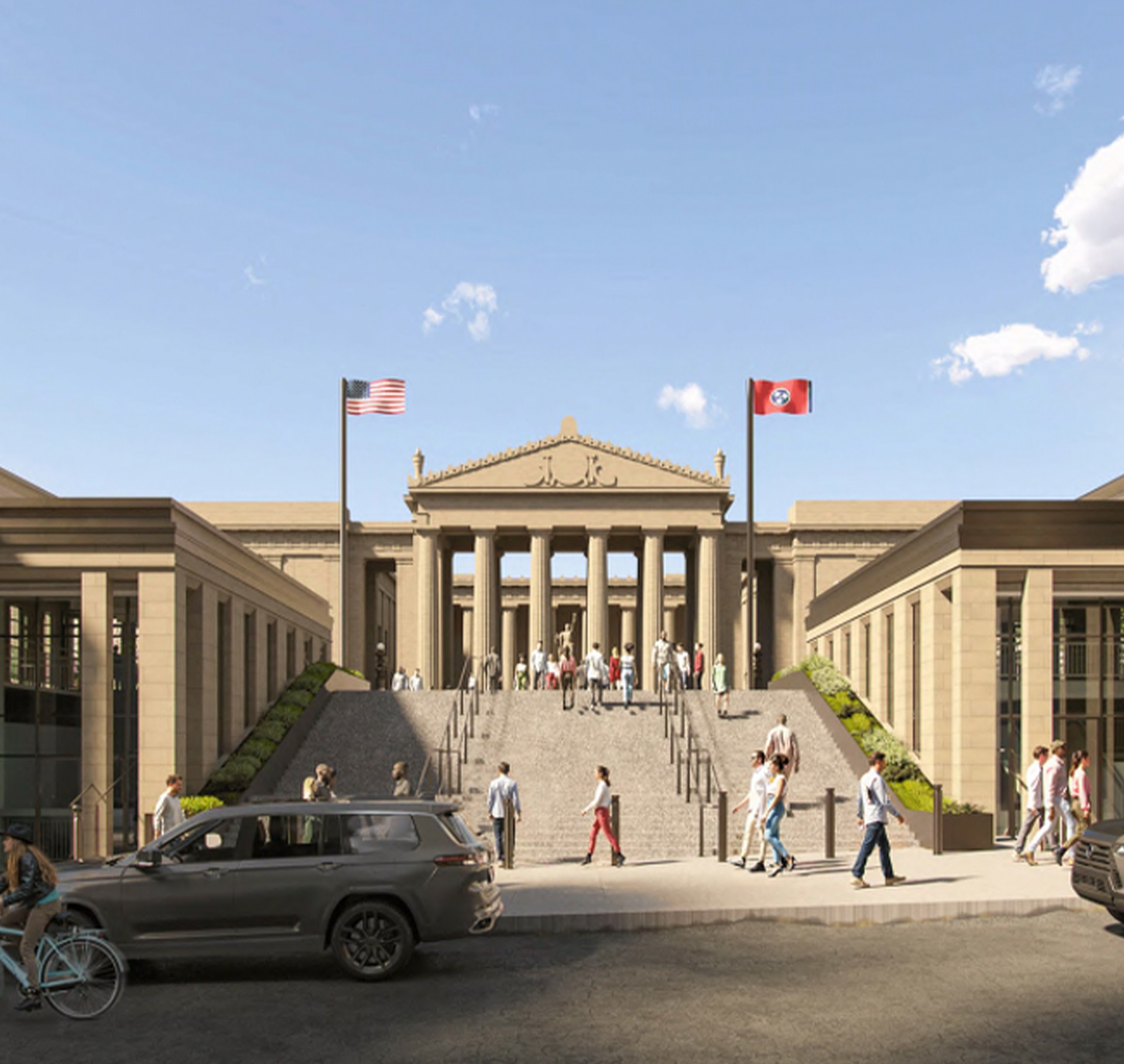 Historic building with columns and steps, flanked by American and Tennessee flags.