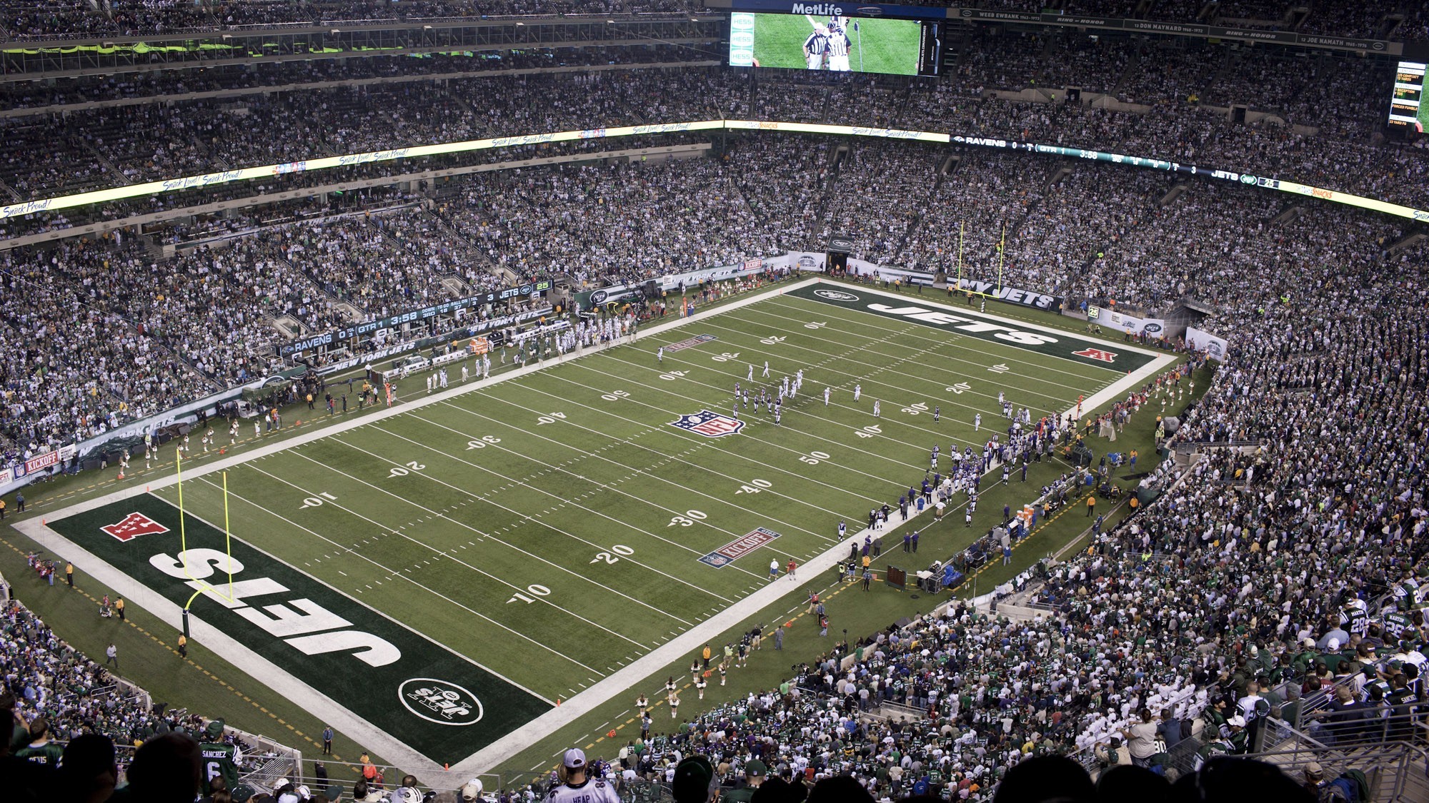 A packed MetLife Stadium hosting a lively NFL football game featuring the New York Jets.