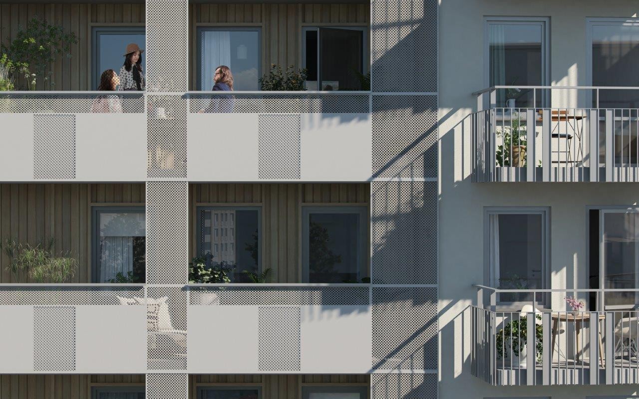 Närbild av fasad med balkonger av olika slag. Inbäddade i fasaden samt med placering utanpå.